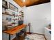 Comfortable office space with built-in shelving, wood ceiling and a window providing natural light at 460 W Hinshaw Dr, Nineveh, IN 46164
