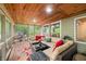 Relaxing sunroom with wood ceiling and access to outdoor deck and wooded scenery at 460 W Hinshaw Dr, Nineveh, IN 46164