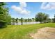 Sprawling backyard with a scenic pond, lush green lawn and mature trees at 4749 Rocky Knob Ln, Indianapolis, IN 46254