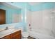 Cozy bathroom featuring a combined shower and bathtub, a toilet, and sink with vanity at 4749 Rocky Knob Ln, Indianapolis, IN 46254