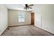 Modest bedroom with neutral walls, carpet and a window with blinds at 4749 Rocky Knob Ln, Indianapolis, IN 46254