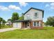 Charming two-story home with a two-car garage and a basketball hoop in the driveway at 4749 Rocky Knob Ln, Indianapolis, IN 46254