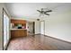 Spacious living room with ceiling fan and views of the open-concept kitchen at 4749 Rocky Knob Ln, Indianapolis, IN 46254
