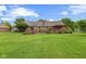 Spacious backyard featuring a beautiful deck, pergola, and well-manicured landscaping at 476 Turnberry Ct, Avon, IN 46123
