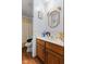 Bathroom featuring a vanity with storage cabinet, seashell themed border, decorative mirror and shower with curtain at 476 Turnberry Ct, Avon, IN 46123
