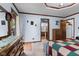 Bedroom with light blue walls, wood trim and vintage furnishings, including a dresser, mirror, and bed at 476 Turnberry Ct, Avon, IN 46123