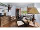 Bedroom features a desk, chair, and book shelves next to a large window, desk and swivel chair at 476 Turnberry Ct, Avon, IN 46123
