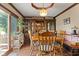 Traditional dining room with a large wooden table, built-in hutch, and a view of the outdoors at 476 Turnberry Ct, Avon, IN 46123