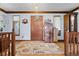 Inviting foyer with hardwood floors, a decorative rug, and natural light streaming through the windows at 476 Turnberry Ct, Avon, IN 46123