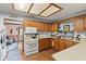 Traditional kitchen with wooden cabinetry, ample counter space, and natural light at 476 Turnberry Ct, Avon, IN 46123