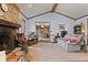 Bright living room features vaulted ceilings, a brick fireplace, and an open floor plan at 476 Turnberry Ct, Avon, IN 46123