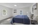 Cozy bedroom with a comfortable bed, soft carpet, and a relaxing atmosphere, with views from two windows at 4836 Winthrop Ave, Indianapolis, IN 46205