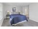 This bedroom features a comfortable bed, soft carpet, and bedside tables with lamps for a relaxing atmosphere at 4836 Winthrop Ave, Indianapolis, IN 46205