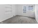 Neutral bedroom showcases a window and neutral carpet, ideal for personalization at 4836 Winthrop Ave, Indianapolis, IN 46205