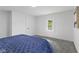 Bedroom featuring soft carpet, a bright window and door offering natural light at 4836 Winthrop Ave, Indianapolis, IN 46205