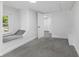This bedroom features neutral carpet, a large window, and a built-in window seat at 4836 Winthrop Ave, Indianapolis, IN 46205