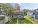 Gray home with green lawn and pathway leading to the front door at 4836 Winthrop Ave, Indianapolis, IN 46205