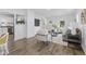 A stylish and open living room layout featuring hardwood floors and a seamless connection to the kitchen at 4836 Winthrop Ave, Indianapolis, IN 46205