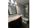 Functional bathroom with granite vanity, walk-in shower, and modern fixtures at 4908 Elmhurst Dr, Indianapolis, IN 46226