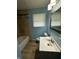 Bathroom featuring a bathtub, tiled shower, and modern sink and vanity at 4908 Elmhurst Dr, Indianapolis, IN 46226