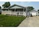Inviting home with a spacious porch and a detached garage, offering both comfort and convenience at 4908 Elmhurst Dr, Indianapolis, IN 46226