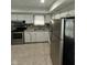 Efficient kitchen featuring modern appliances, white cabinets and ample counter space at 4908 Elmhurst Dr, Indianapolis, IN 46226