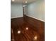 Spacious room with gleaming hardwood floors, offering a versatile living space at 4908 Elmhurst Dr, Indianapolis, IN 46226
