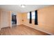This bedroom features wood laminate flooring and natural lighting from two windows at 517 N Leland St, Fortville, IN 46040