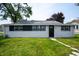 Charming single-story home with a well-maintained lawn and stone pathway at 517 N Leland St, Fortville, IN 46040
