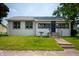 Charming single-story home featuring a well-maintained lawn, bird bath, and neutral exterior at 517 N Leland St, Fortville, IN 46040