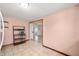 Eat-in kitchen with tile flooring, open shelving, and adjacent dining area at 517 N Leland St, Fortville, IN 46040