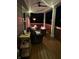 Atmospheric back porch at night, featuring string lights, comfortable seating, and a warm, inviting ambiance at 5199 Green Valley Ln, Noblesville, IN 46062