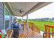 Inviting back porch with ample seating, wooden deck, and a view of the well-maintained backyard at 5199 Green Valley Ln, Noblesville, IN 46062
