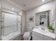 The bathroom features a toilet and a vanity with a sink and a walk-in shower at 5199 Green Valley Ln, Noblesville, IN 46062
