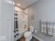 Clean bathroom with a shower-tub combo, neutral colors, and modern fixtures at 5199 Green Valley Ln, Noblesville, IN 46062