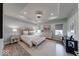 Spacious bedroom features a tray ceiling, soft colors, wood flooring and light color furniture at 5199 Green Valley Ln, Noblesville, IN 46062