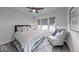 Serene bedroom featuring a comfortable bed, soft natural light, and a cozy armchair at 5199 Green Valley Ln, Noblesville, IN 46062