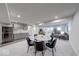 An open dining area with a table and seating for six is next to the living room and kitchen at 5199 Green Valley Ln, Noblesville, IN 46062