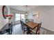 Cozy dining area featuring a wooden table, neutral decor, and ample natural light at 5199 Green Valley Ln, Noblesville, IN 46062