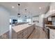 Modern kitchen with a large center island, stainless appliances, and an open layout at 5199 Green Valley Ln, Noblesville, IN 46062