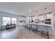 Bright, open kitchen boasts a large island, modern pendant lighting, and stainless steel appliances at 5199 Green Valley Ln, Noblesville, IN 46062