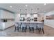 Spacious kitchen with a large island, modern cabinetry, and stylish pendant lighting at 5199 Green Valley Ln, Noblesville, IN 46062
