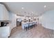 Spacious kitchen featuring a large island with bar seating, white cabinets, and modern appliances at 5199 Green Valley Ln, Noblesville, IN 46062