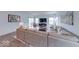Spacious living room with a large sectional, wood floors, and a view to the outdoors at 5199 Green Valley Ln, Noblesville, IN 46062