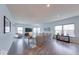 Open living room with large sectional sofa, TV, and many windows providing ample natural light at 5199 Green Valley Ln, Noblesville, IN 46062
