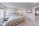 The main bedroom has a queen-sized bed, two lamps, and opens up to the hallway at 5199 Green Valley Ln, Noblesville, IN 46062