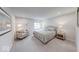 A spacious main bedroom is furnished with a queen-sized bed and an armchair at 5199 Green Valley Ln, Noblesville, IN 46062