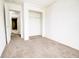 Bedroom with closet and neutral carpet, offering a blank canvas for personalization at 5234 Melbourne Rd, Indianapolis, IN 46228