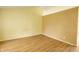 Empty bedroom features wood floor and yellow walls at 5234 Melbourne Rd, Indianapolis, IN 46228