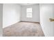 Bedroom with carpet, one window, and closet at 5234 Melbourne Rd, Indianapolis, IN 46228